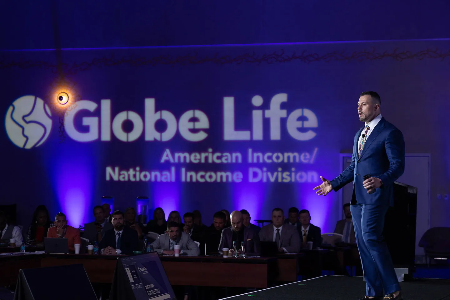 Michael Vasu on stage at a Globe Life event